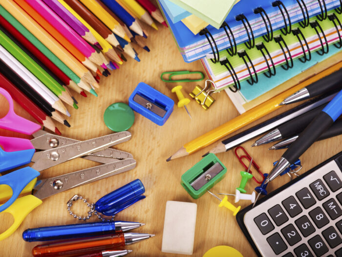 Assorted school and office supplies on a desk, perfect for students at St. Paul's School, a leading school for boys on the Northshore LA.