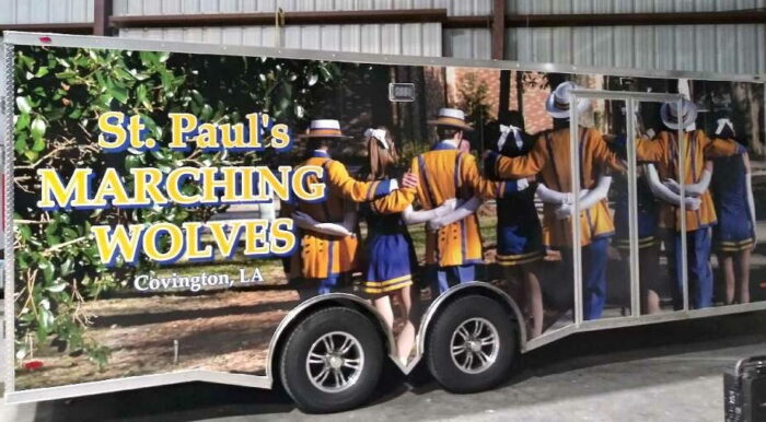 A trailer featuring St. Paul's School band members in blue and yellow uniforms, representing a top school for boys on the Northshore, LA.