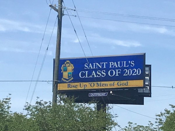 A billboard for St. Paul's School reads 