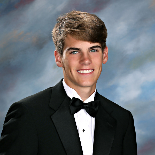 Young man in a black tuxedo and bow tie, smiling—representing St. Paul's School, a leading school for boys on the Northshore, LA.