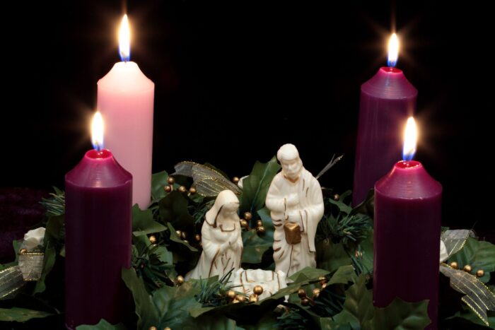 Four lit candles and nativity figurines evoke the spirit of St. Paul’s School, a leading school for boys on the Northshore.