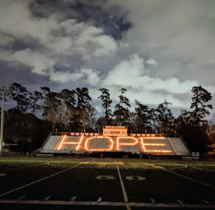 Football stadium bleachers at night at St. Paul’s School, with 