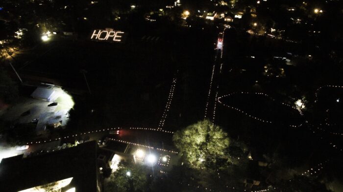 A nighttime aerial of St. Paul's School lights spelling 