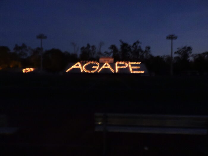 Large illuminated letters spell out 