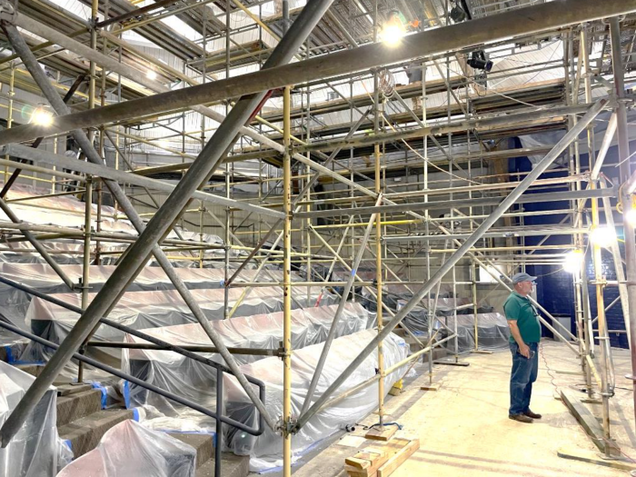 A man stands near scaffolding in a construction area at St. Paul's School, a leading school for boys on the Northshore, LA.