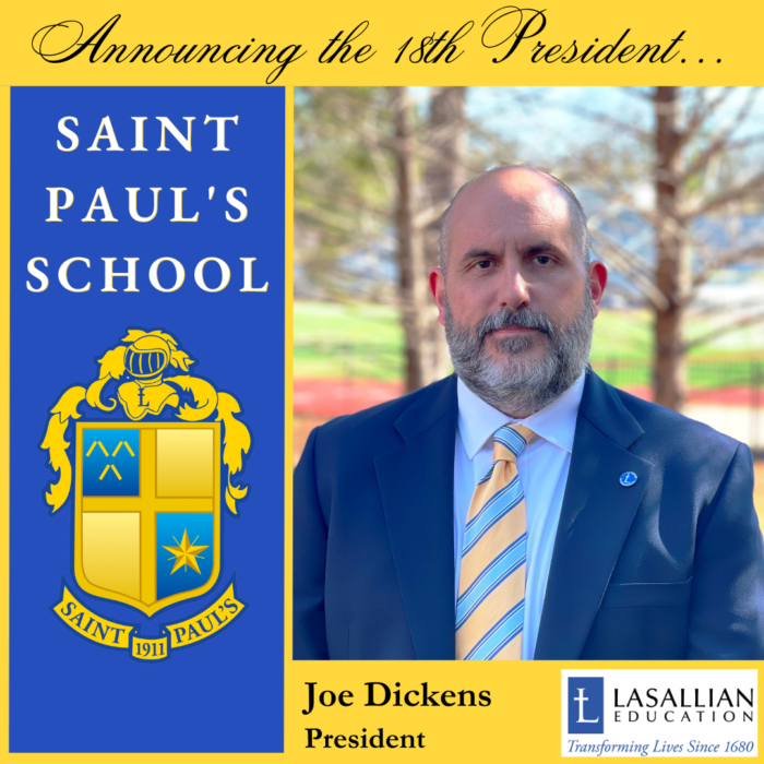 A man in a suit stands by a St. Paul's School sign, announcing Joe Dickens as the 18th president, with the school's crest visible.