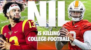 Two college football players in uniforms with 